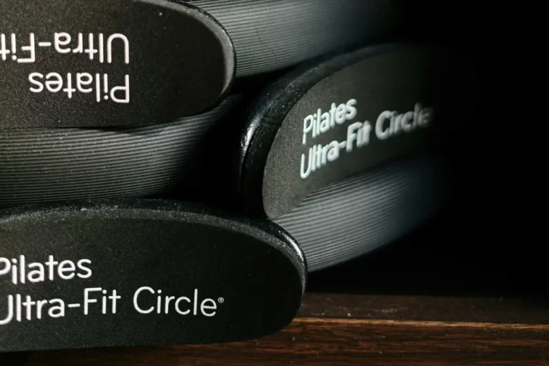 Close-up of Pilates Ultra-Fit Circles neatly stacked in a fitness center.